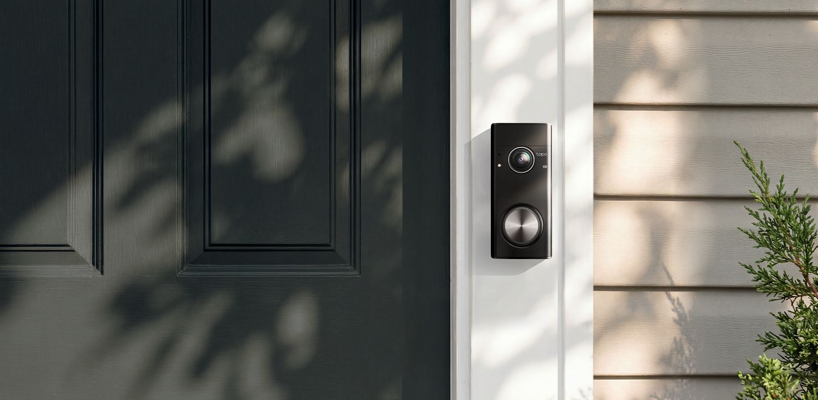 Tapo Doorbell Pro D260 mounted beside a front door